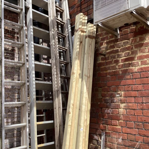 Stacked timber bundles for construction and DIY projects.