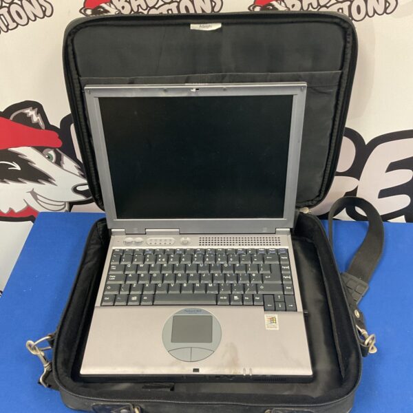 Vintage Packard Bell Easy One laptop with charger, retro computing collectible.