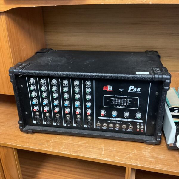 Vintage Protek PA6 powered mixer with multiple channel controls.