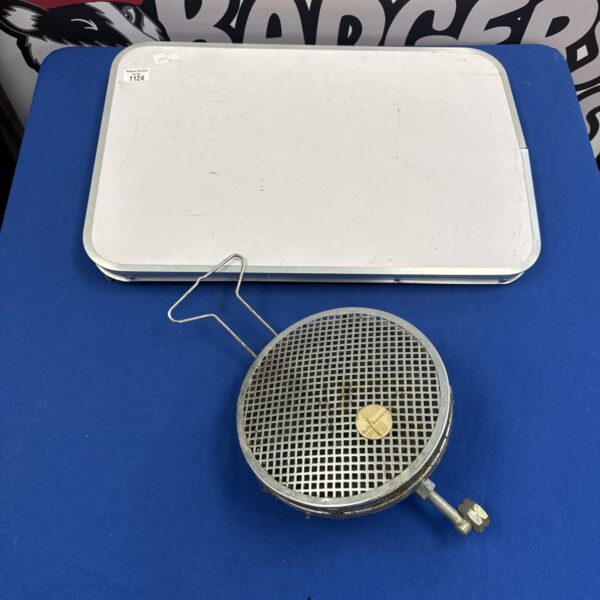 Vintage Butatherm heater with folding table for portable heating.