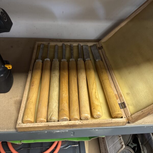 Vintage wood turning chisels in a wooden case, classic woodworking tools.