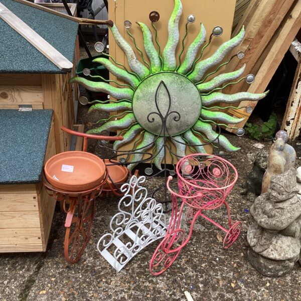Rusted metal garden sun ornament for outdoor decor.