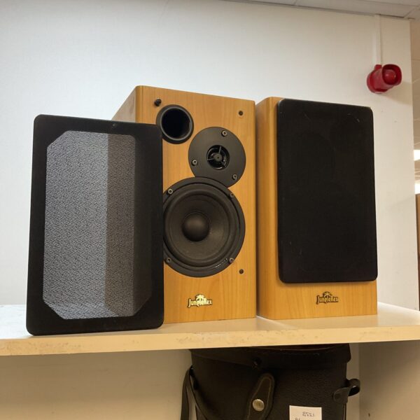 Pair of vintage Jungle Rex bookshelf speakers on display.
