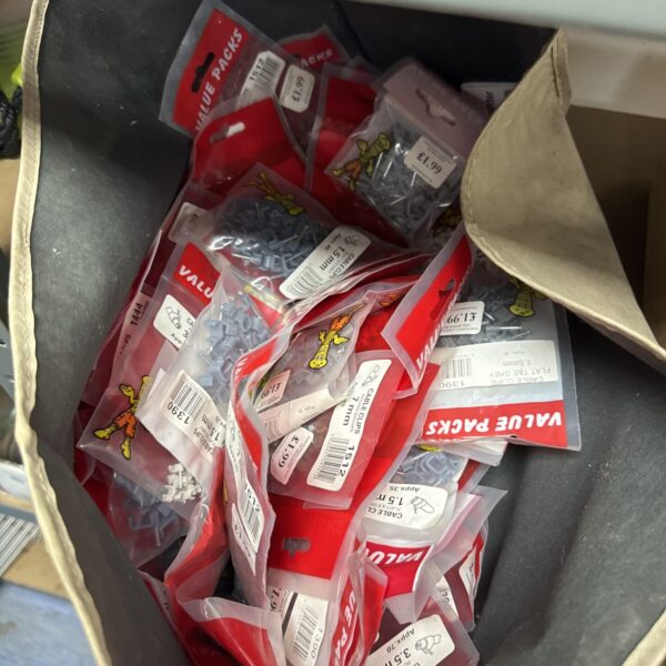Assorted plastic cable clips for electrical wiring and cable management.