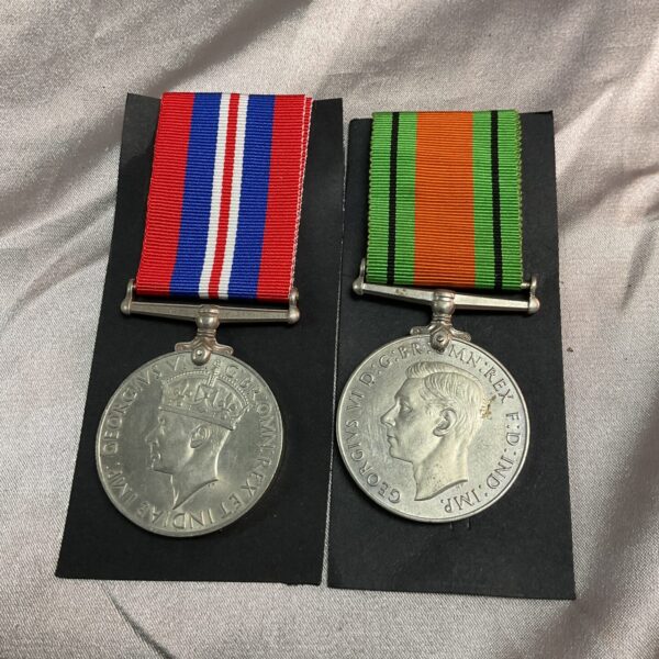 WWII British Defence and War Medals with ribbons.