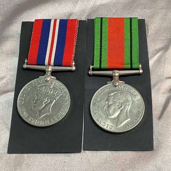 WWII British war and defence medals with ribbon detailing.