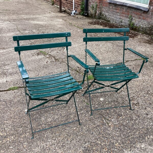 Vintage folding metal chairs for garden or patio use.