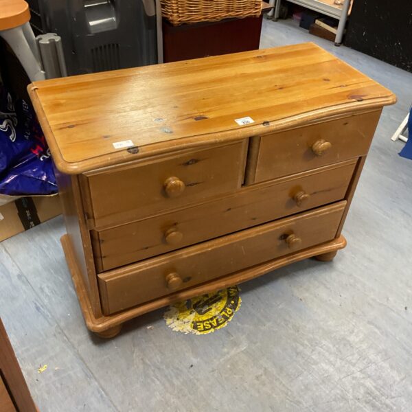 Small pine chest of drawers with two drawers over two.