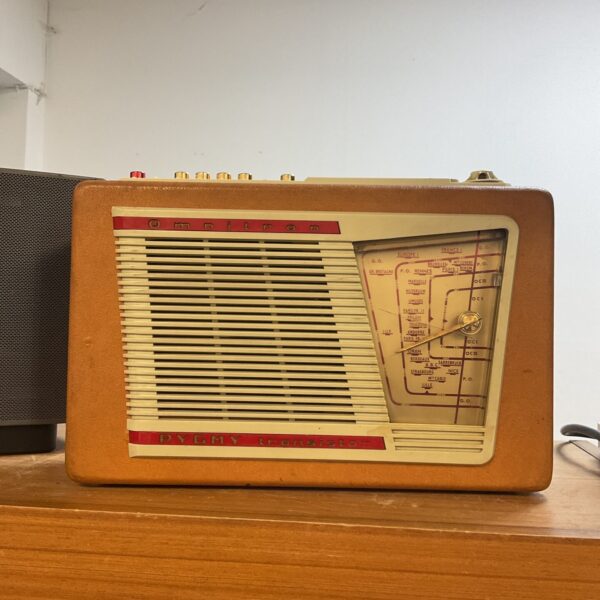 Vintage Omnitron Pygmy transistor radio, front view.
