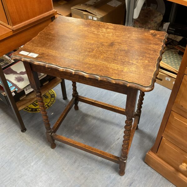 Antique oak side table with barley twist legs and pie crust edge.