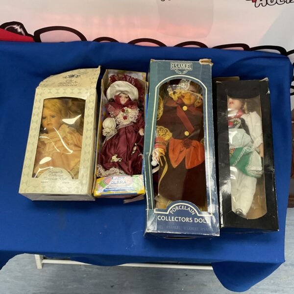 Boxed vintage collector dolls including porcelain and H Samuel examples.