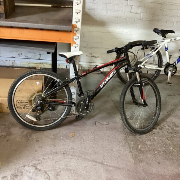 Side view of a used Specialized Hotrock youth mountain bike.