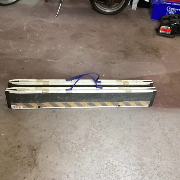 Portable folding mobility ramps for wheelchair access.