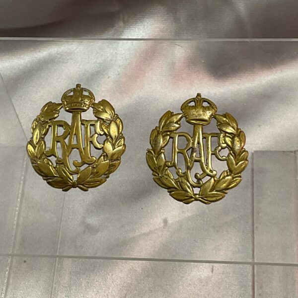 Vintage WWII RAF cap badges, brass military insignia.