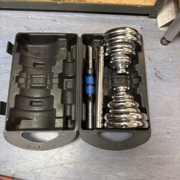 Metal dumbbell weight set with barbell extension in carrying case.