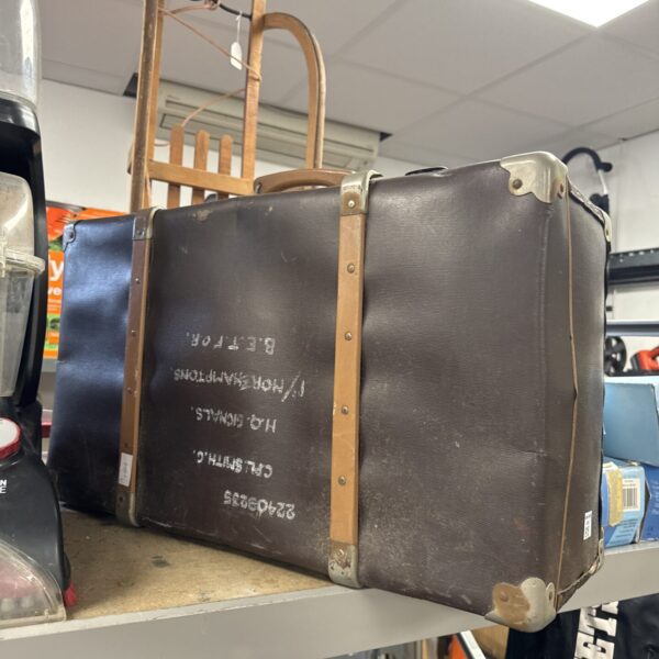 Side view of a vintage steamer trunk, antique travel luggage.