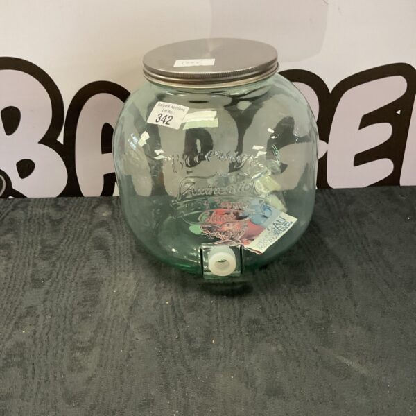 Clear glass drinks dispenser with a wide opening.