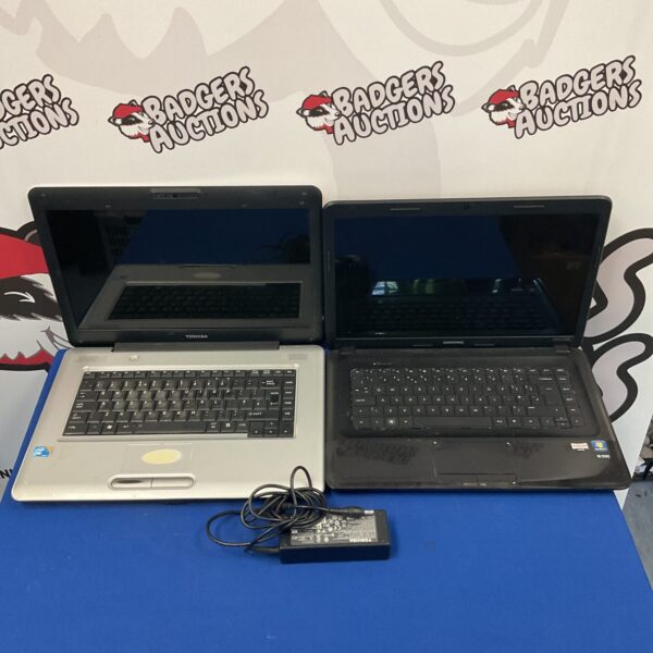 Used Toshiba laptop with charger, ideal for repair or parts.