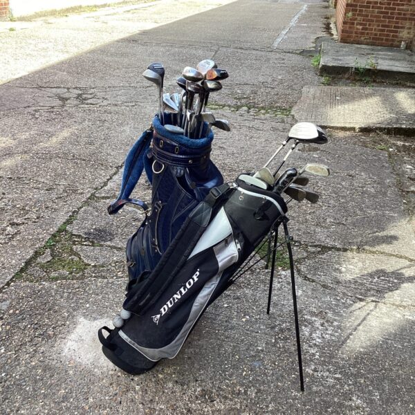 Vintage Dunlop golf club set in a blue bag.