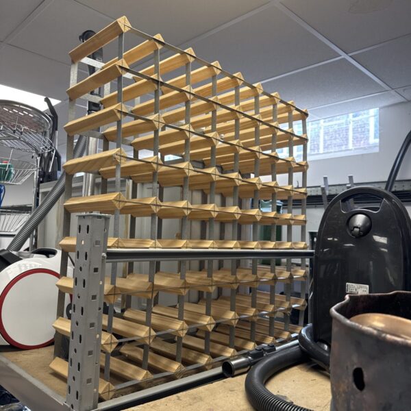 Large wooden wine bottle rack for wine storage and display.