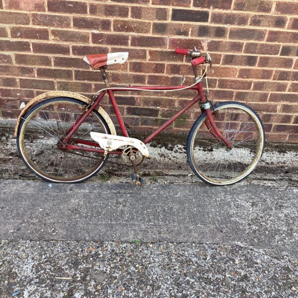 Side view of a vintage Vindec bicycle for restoration.