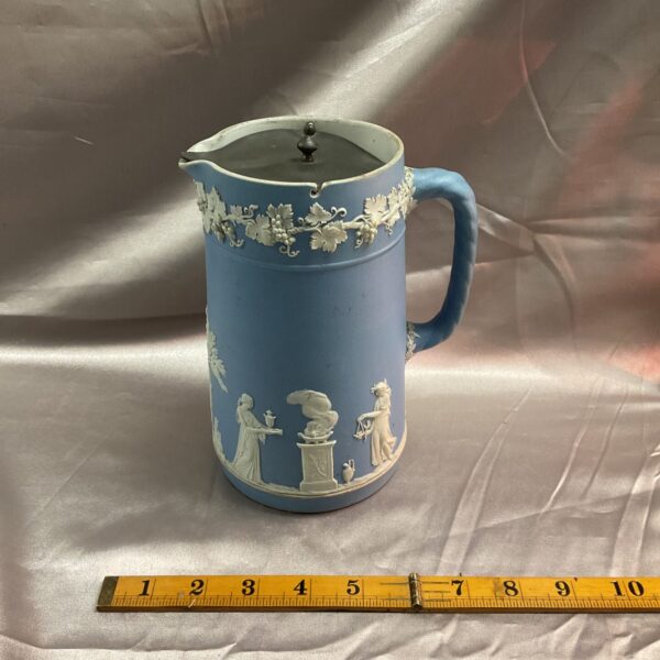 Antique Wedgwood Jasperware jug with blue background and pewter lid.