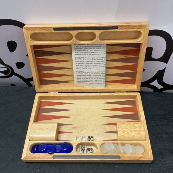 Vintage wooden backgammon set with playing pieces and dice.