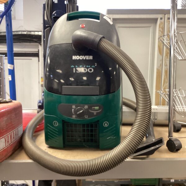 Vintage Hoover Alpine 2 1300 vacuum cleaner with green casing.