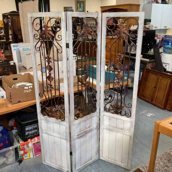 Vintage room divider screen with white wood and metal detailing.