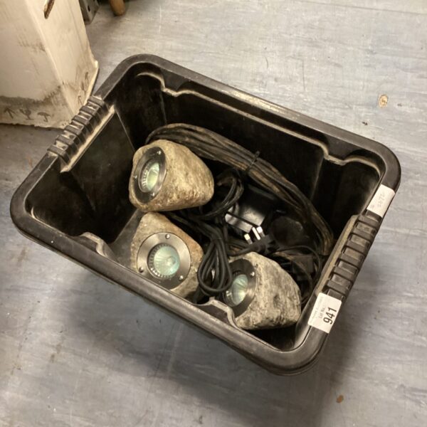 Lot of three weathered garden stone lights for outdoor use.
