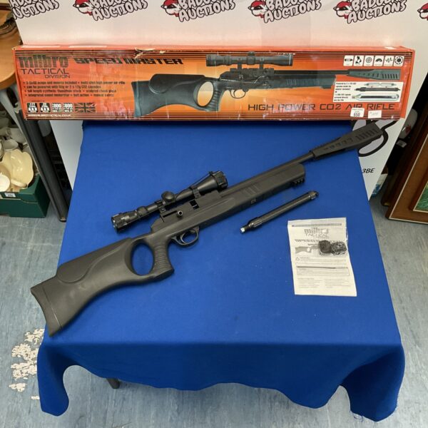 Black Milbro Speedmaster air rifle with scope attached.