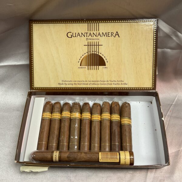 Vintage Guantanamera cigar box with remaining cigars inside.