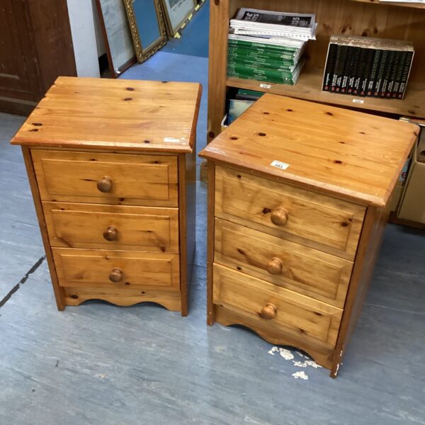 Pair of vintage pine bedside cabinets with two drawers.