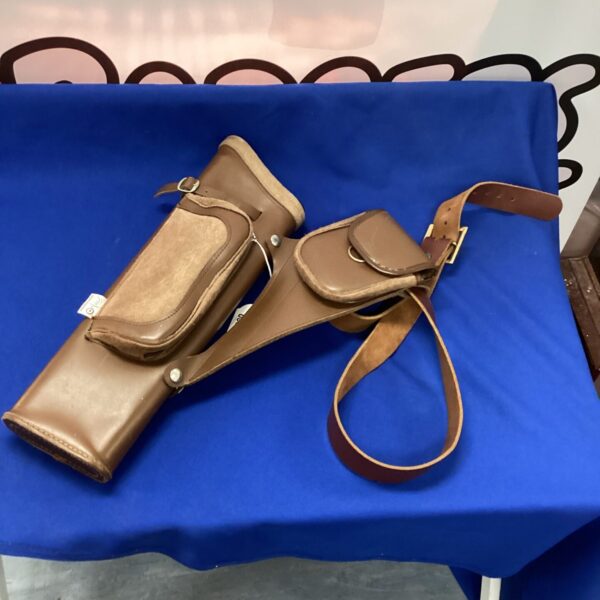 Vintage leather arrow quiver for archery and hunting equipment.