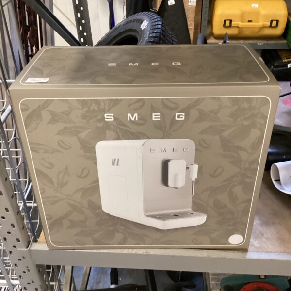 Retro Smeg coffee machine in a box, vintage kitchen appliance.
