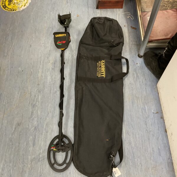 Garrett Ace 250 metal detector with carrying case for treasure hunting.
