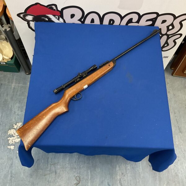 Vintage BSA Meteor .22 air rifle with scope.