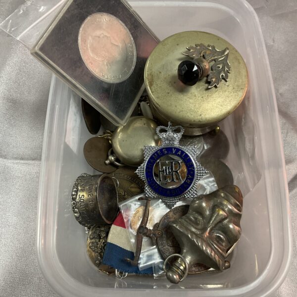 Mixed lot of vintage collectibles including medals and badges.