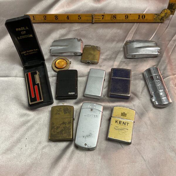 Vintage lighter lot including a Zippo and other metal lighters.