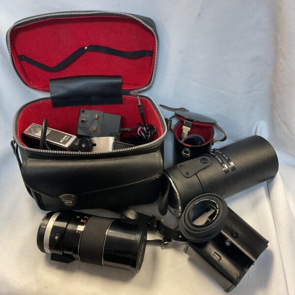 Vintage leather camera bag with Tamron zoom lens and accessories.
