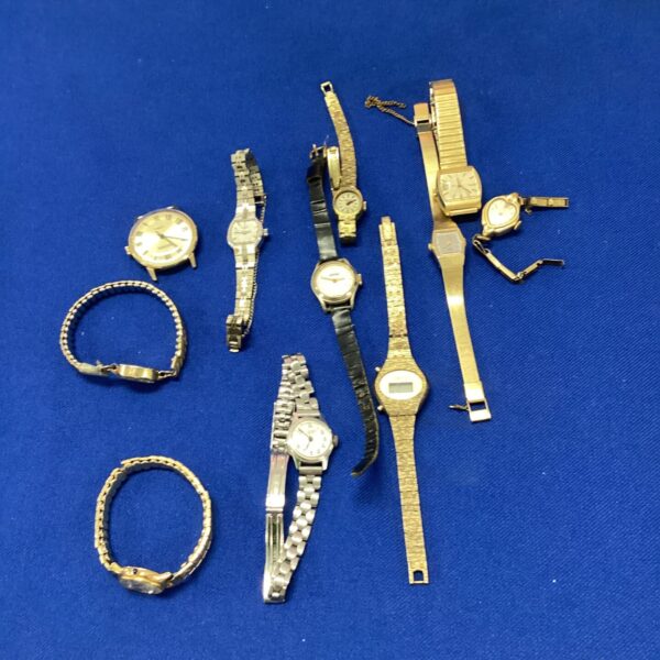 Assorted ladies wrist watches in gold tones, vintage fashion timepieces.