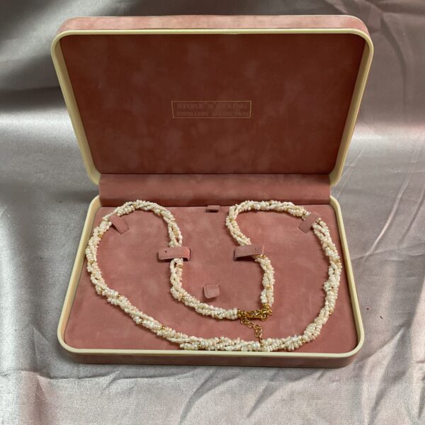Lustrous freshwater pearl necklace with a spring clasp.