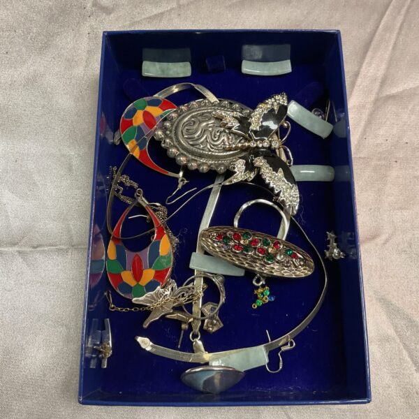 Tray of mixed jewellery including silver and costume pieces.