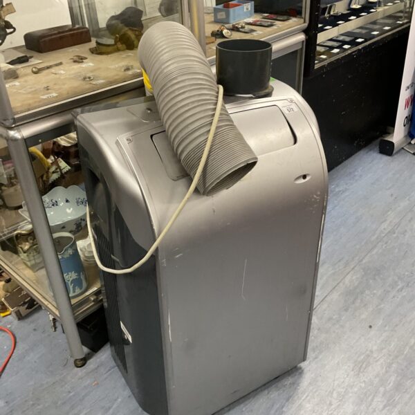 Large military air conditioner unit with flexible duct.