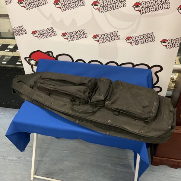 Large Miltec rifle case shown against a blue background.