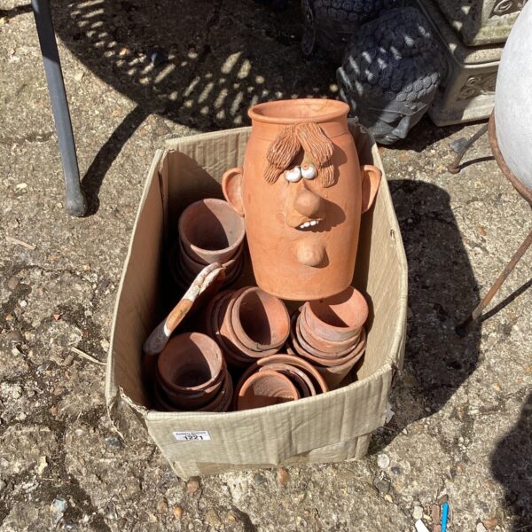 Lot of terracotta flower pots for garden plants.