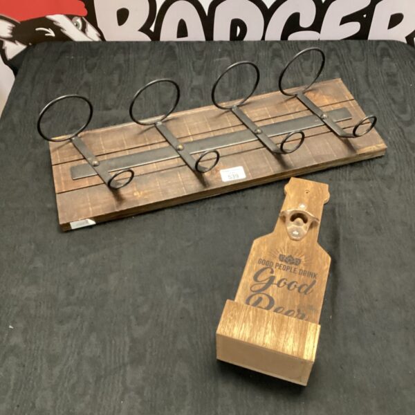 Metal and wood wine bottle wall holder for four bottles.