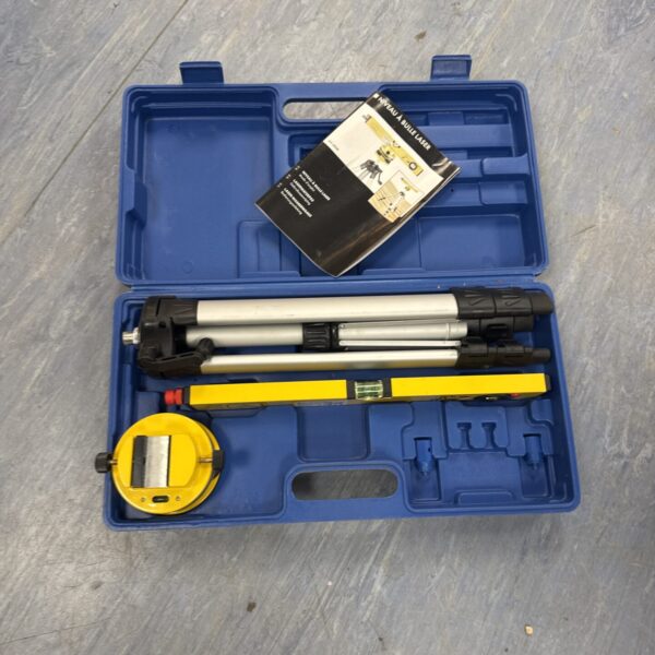 Used laser level set with tripod and carrying case for construction.