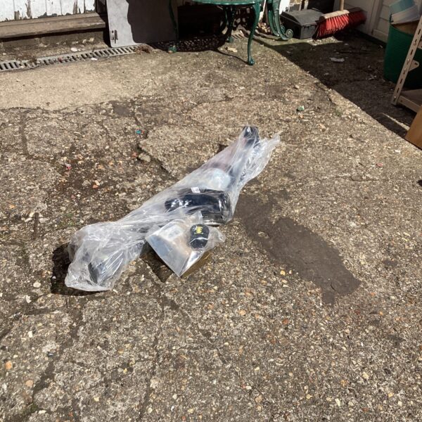 Sealed VW Passat tow bar in plastic packaging.