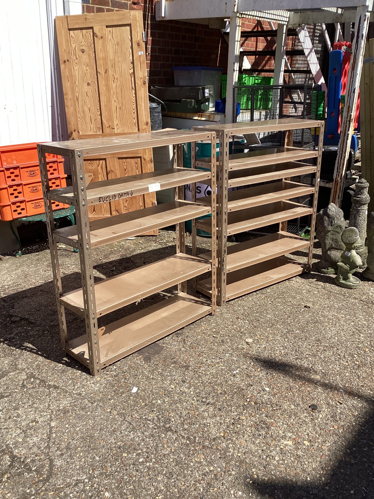 1160 Two metal shelving units